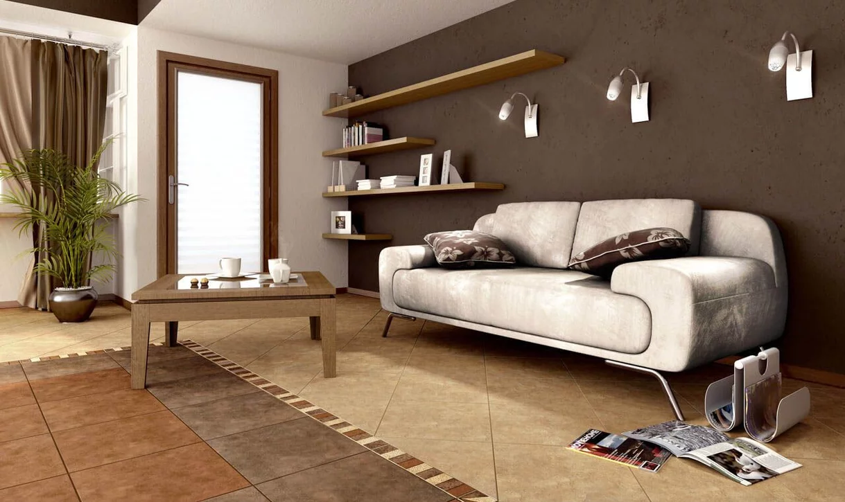 Salon z dużymi kwadratowymi płytkami kamieniopodobnymi na podłodze i czekoladową ścianą z płytek.