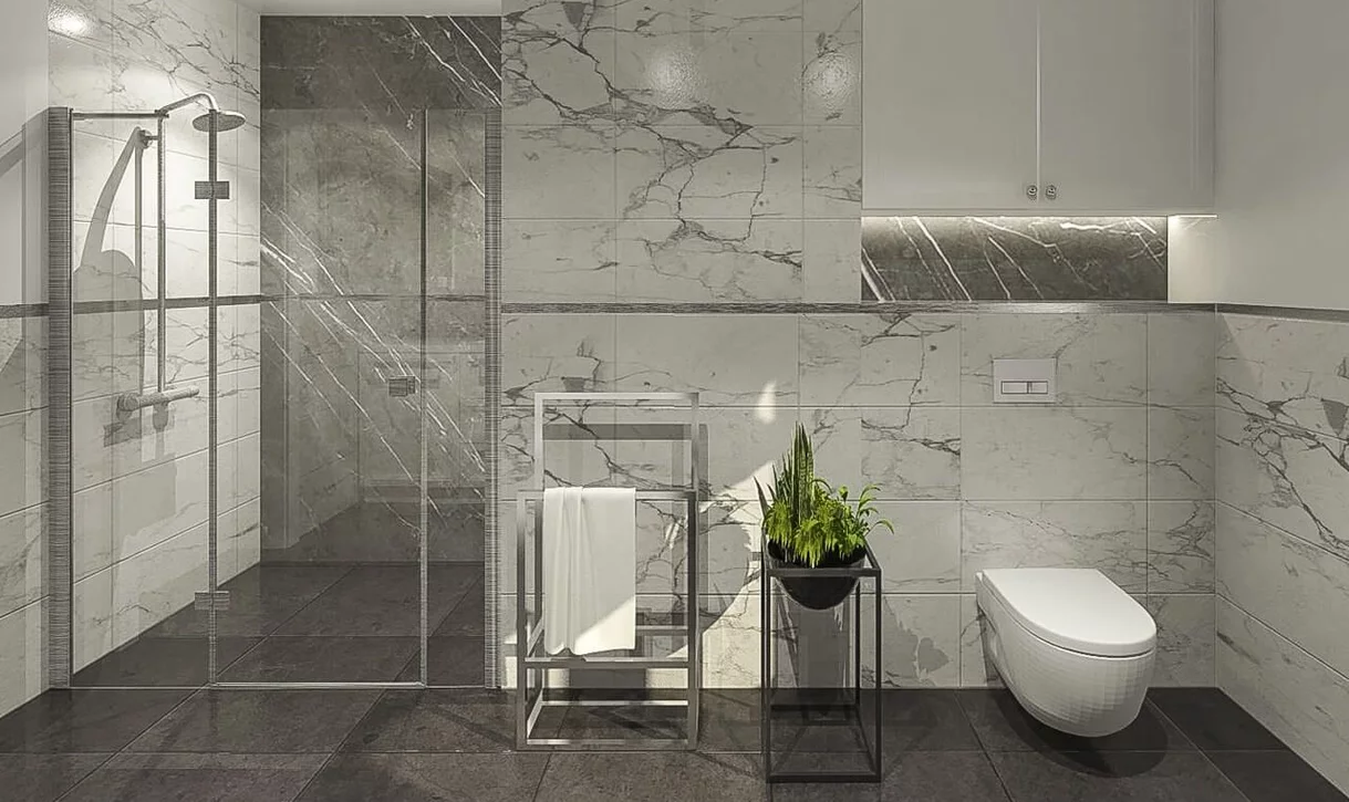 Nowoczesna łazienka z białymi płytkami marmurowymi na ścianach i ciemnymi płytkami kamieniopodobnymi na podłodze i w prysznicu.