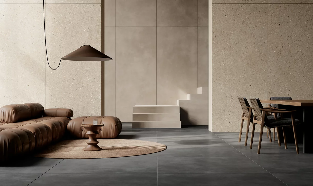 Minimalistyczne wnętrze z matowymi płytkami imitującymi beton z kolekcji Architeq i beżowymi płytkami na ścianach.