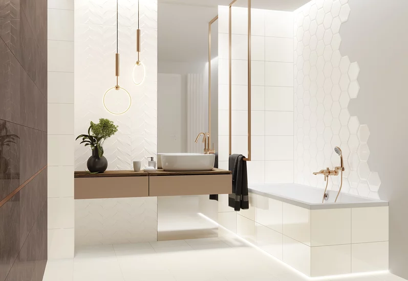 Nowoczesna łazienka z białymi płytkami ściennymi z kolekcji Ideal o różnych fakturach i wzorach.