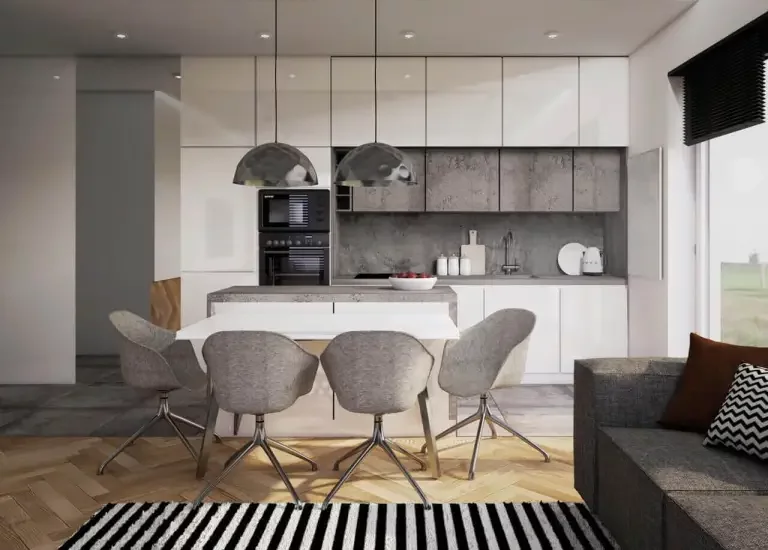 Nowoczesna kuchnia z białymi szafkami i kamieniopodobnymi płytkami na ścianie oraz drewnianą podłogą w jodełkę.